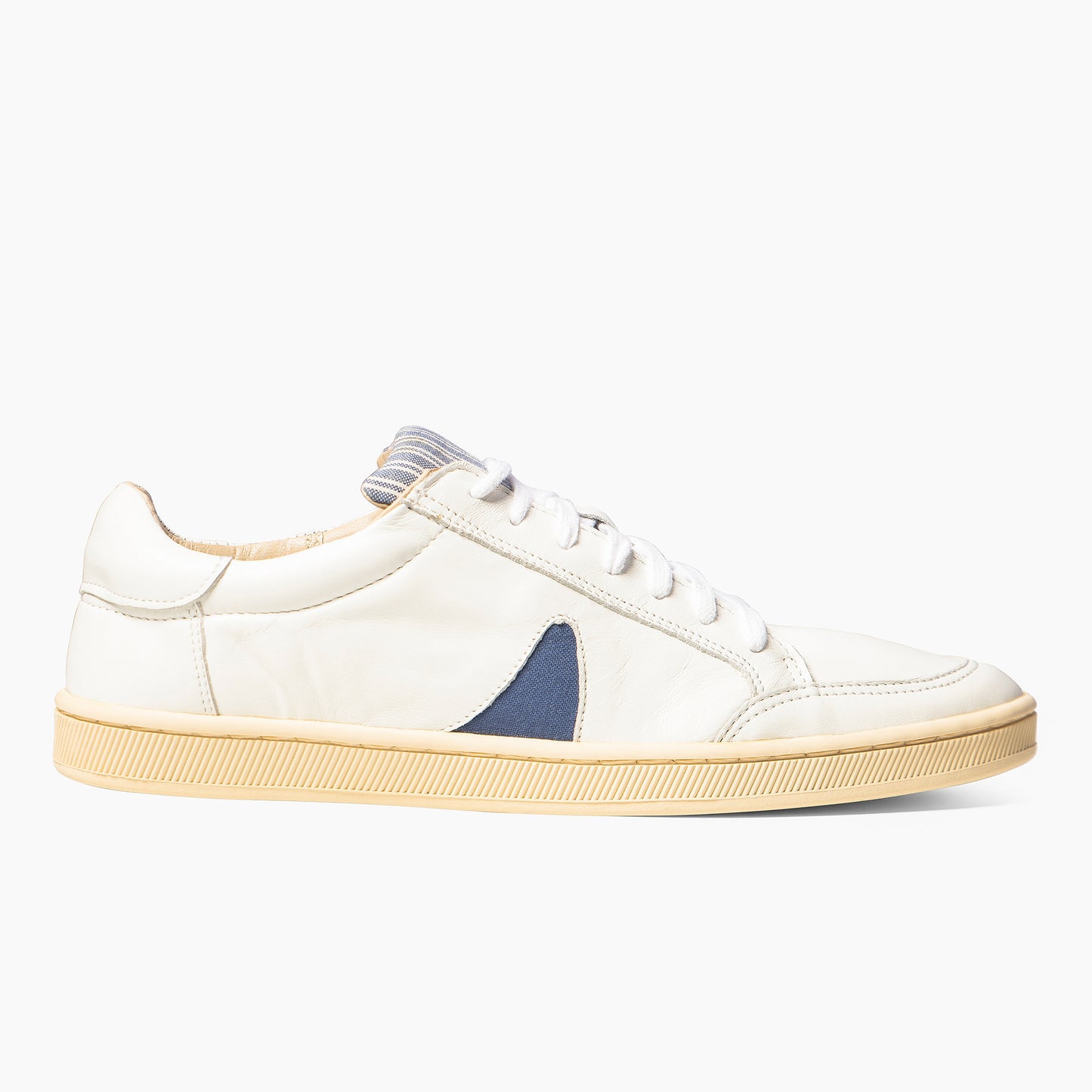 
                  
                    White Leather Blue Horn Nomad Classic Unisex Sneakers
                  
                